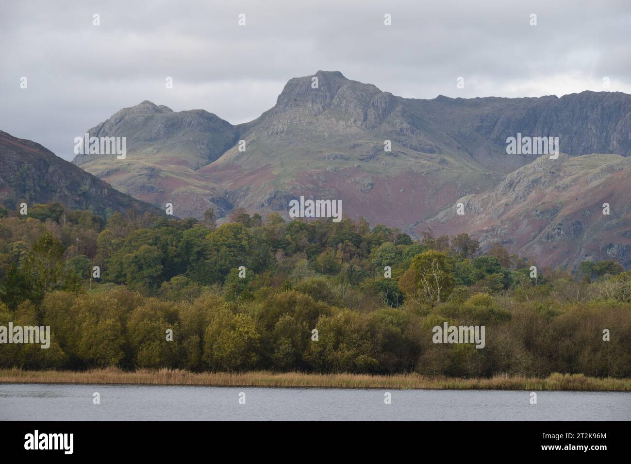 The Langdales over Elterwater lake Stock Photo