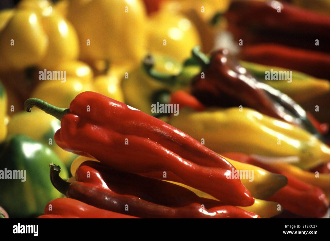 Food products, red and yellow peppers on market stall Stock Photo - Alamy