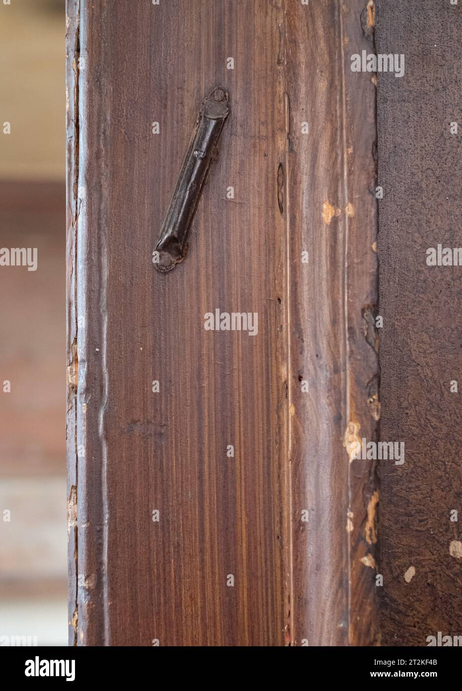 Interior detail showing an Jewish mezuzah on the door of a shabby