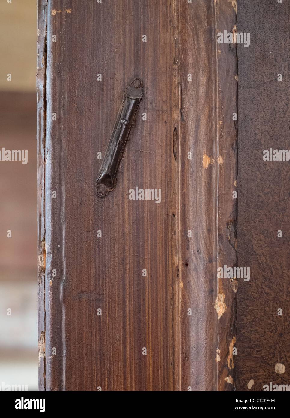 Interior detail showing an Jewish mezuzah on the door of a shabby