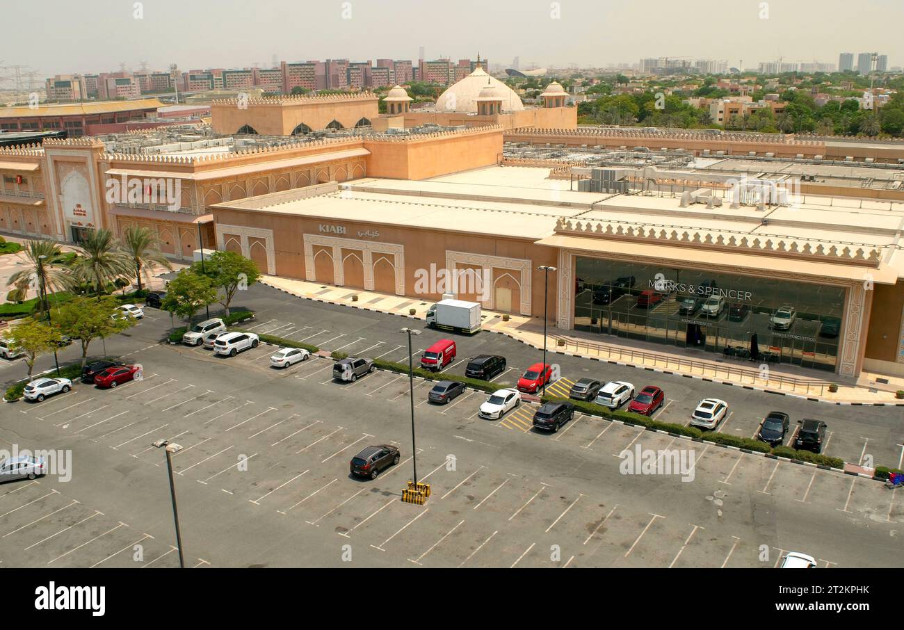 Dubai - UAE - August 13, 2023: Ibn Battuta Mall exterior with many parking lots. Dubai shopping mall entrance Stock Photo