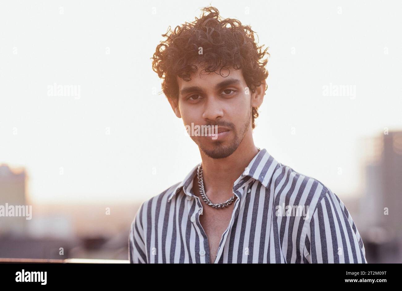 Stylish modern young curly man hi-res stock photography and images - Alamy