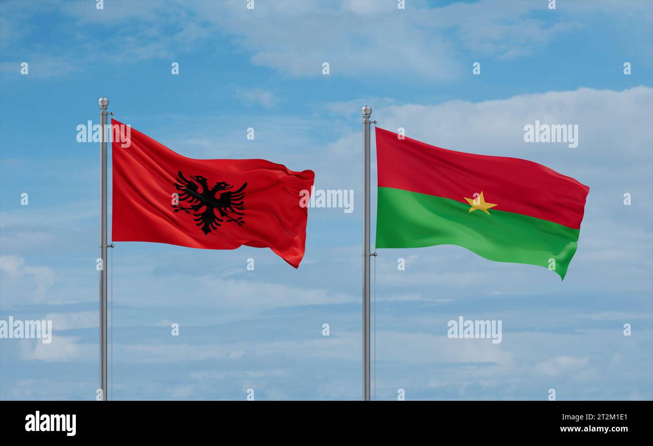 Burkina Faso and Albania flags waving together on blue cloudy sky, two ...