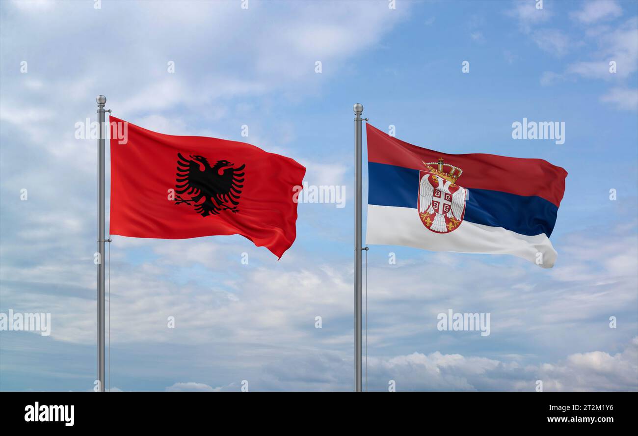 Republic of Serbia and Albania flags waving together in the wind on ...
