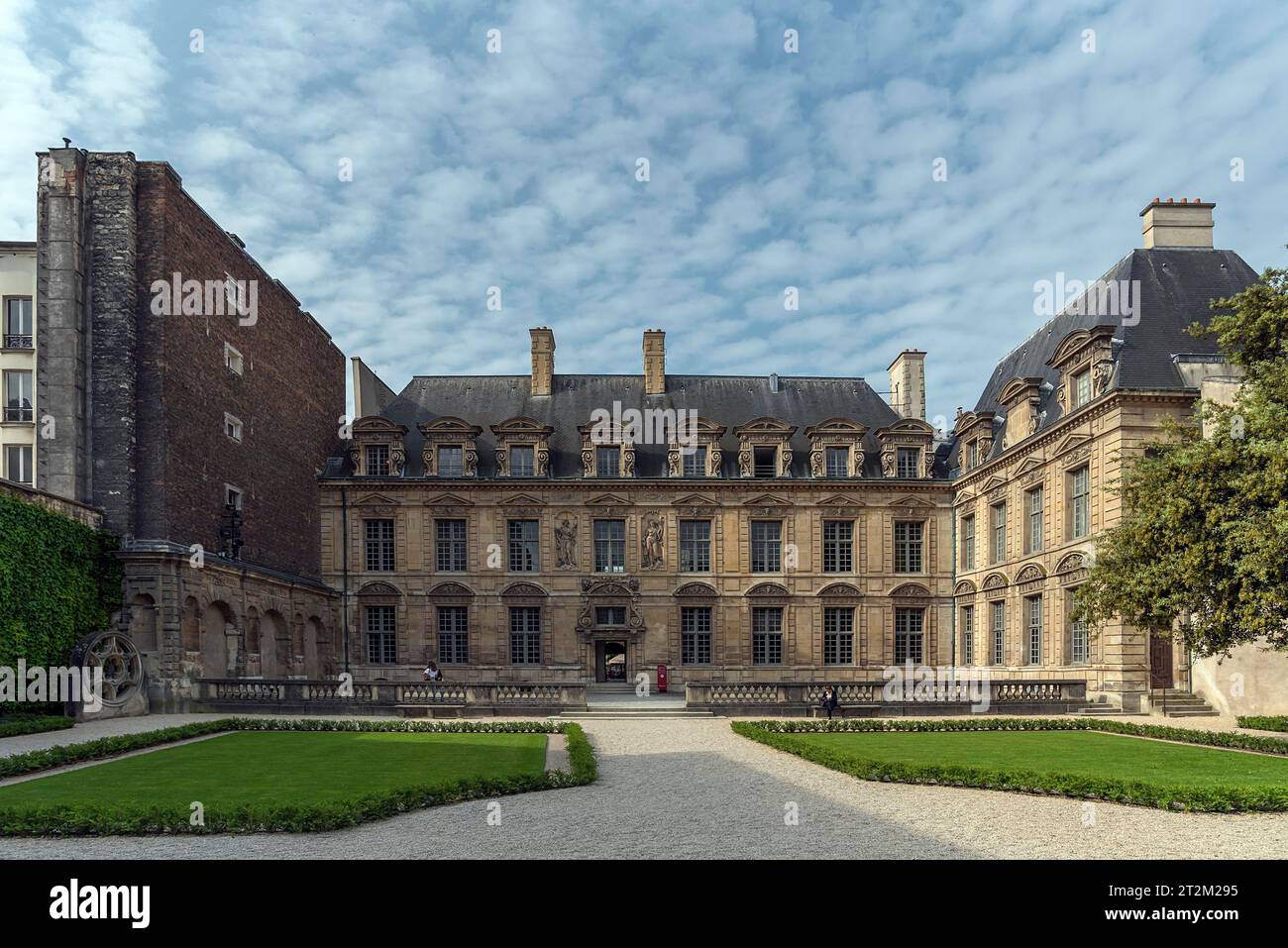 Park and building of the historic Hotel de Sully, built 1625, Paris, France Stock Photo