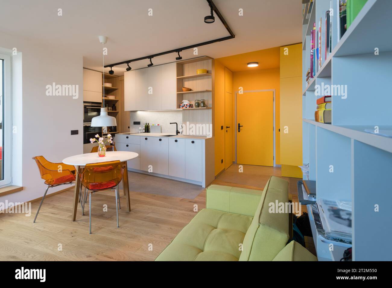 Interior of kitchen with dining table in small urban apartment Stock ...