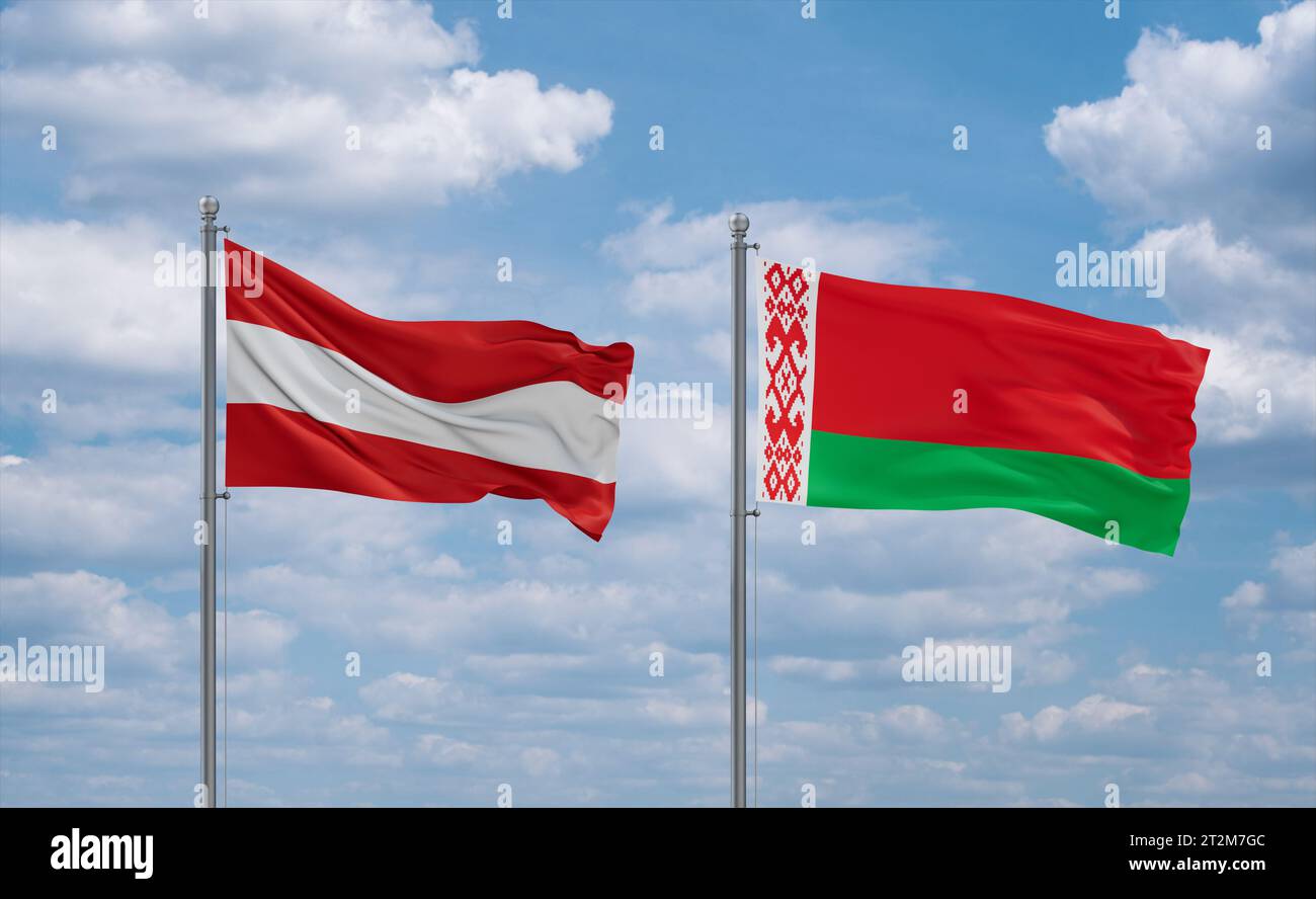 Belarus and Austria flags waving together in the wind on blue cloudy ...