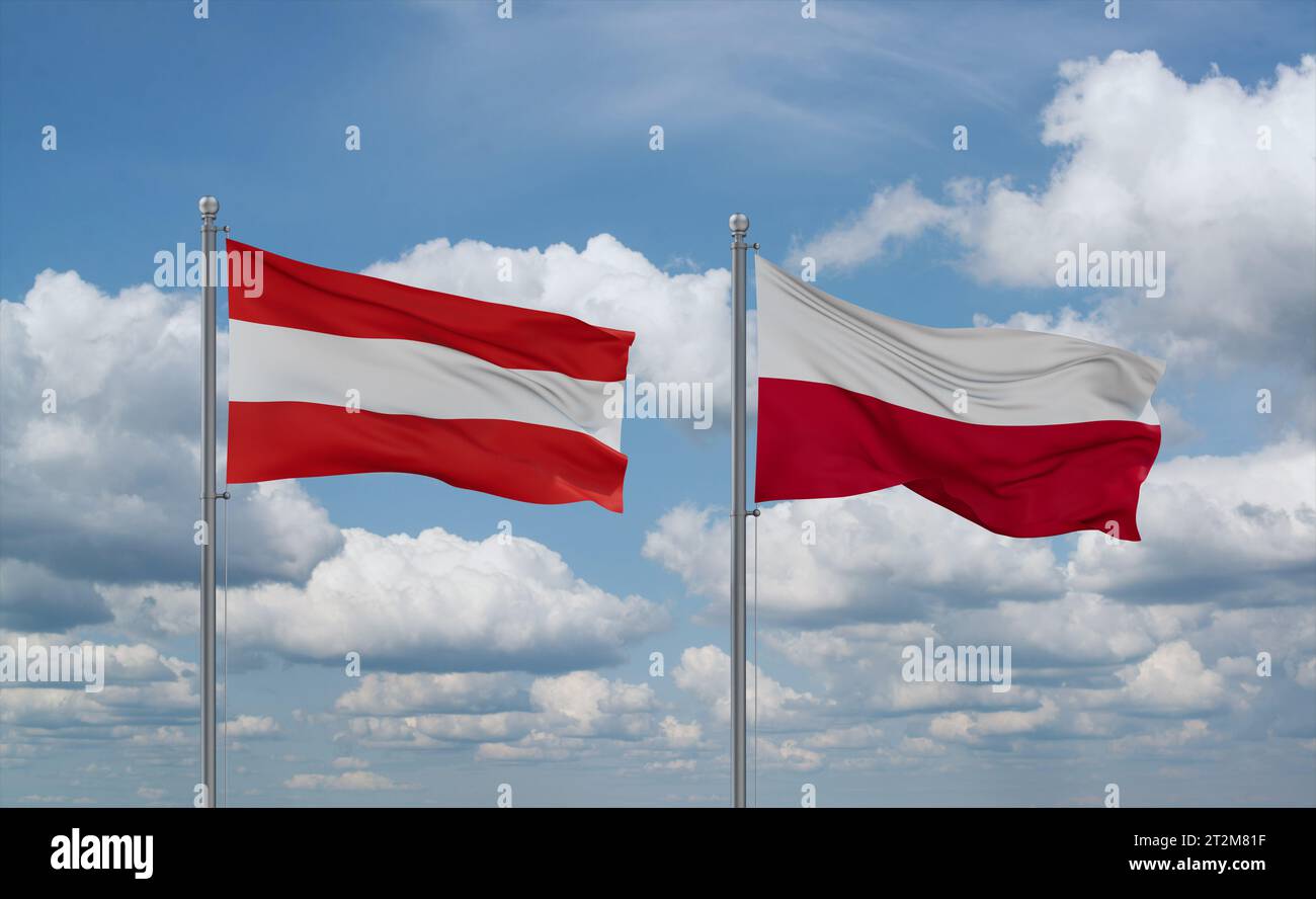 Poland and Austria flags waving together in the wind on blue cloudy sky ...