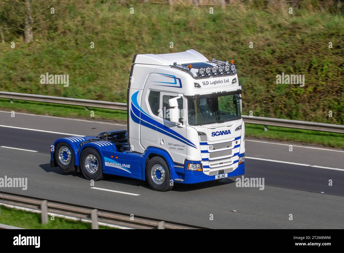 SLD Logistics Ltd, a North-West based logistics service providerHaulage delivery trucks, lorry, transportation, truck, cargo, Super Scania Highline R500 vehicle, R 500 tractor unit commercial transport industry crew cab; travelling at speed on the M6 motorway in Greater Manchester, UK Stock Photo