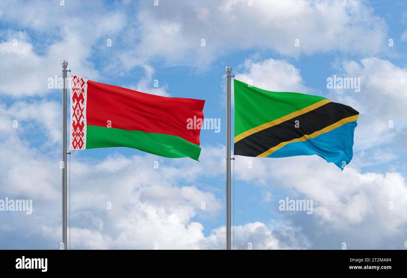 Tanzania and Belarus flags waving together in the wind on blue cloudy ...