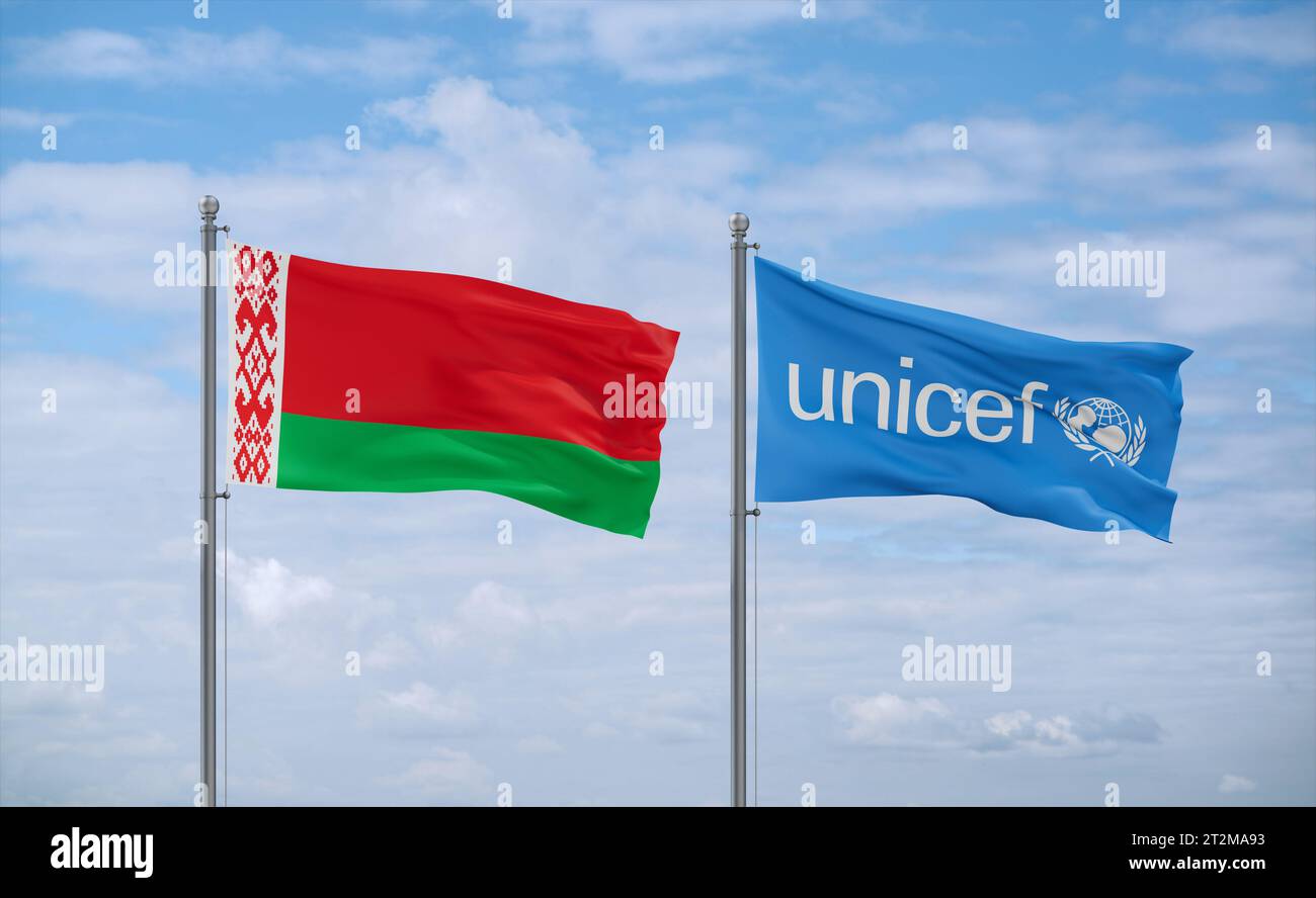 UNICEF and Belarus flags waving together in the wind on blue cloudy sky ...
