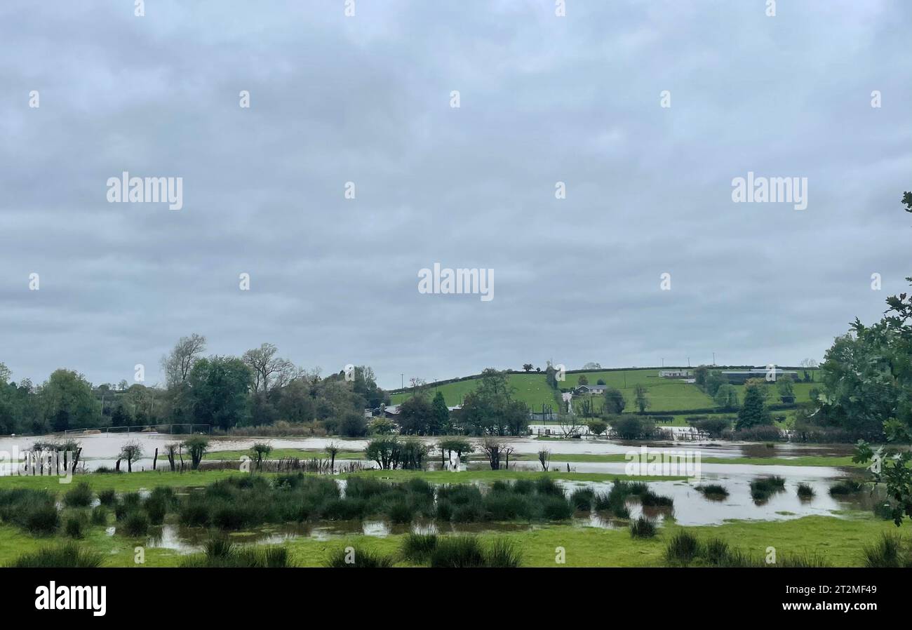 Flooded fields at Ballygawley in Co Tyrone, Northern Ireland, as Storm Babet batters the country. Flood warnings are in place in Scotland, as well as parts of northern England and the Midlands. Thousands were left without power and facing flooding from 'unprecedented' amounts of rain in east Scotland, while Babet is set to spread into northern and eastern England on Friday. Picture date: Friday October 20, 2023. Stock Photo