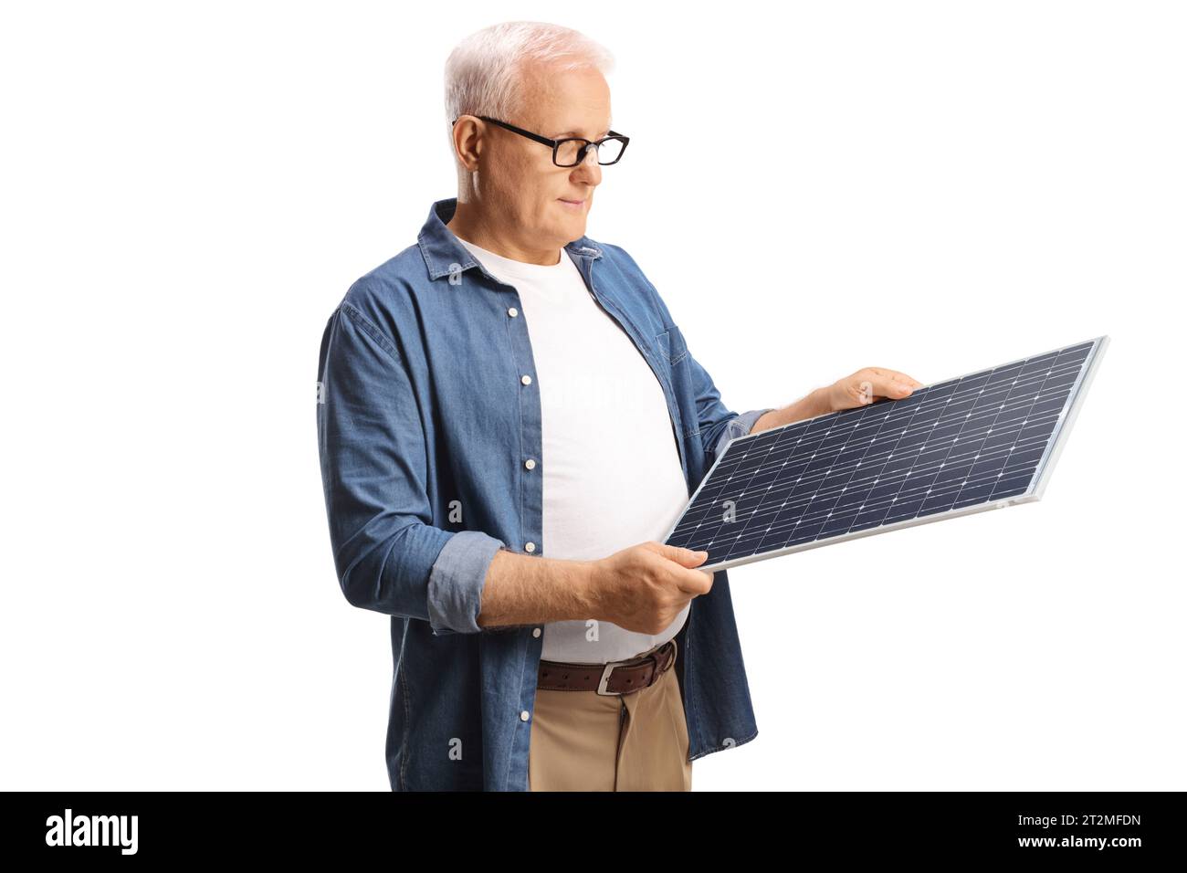 Causal mature man looking at a solar panel isolated on white background Stock Photo