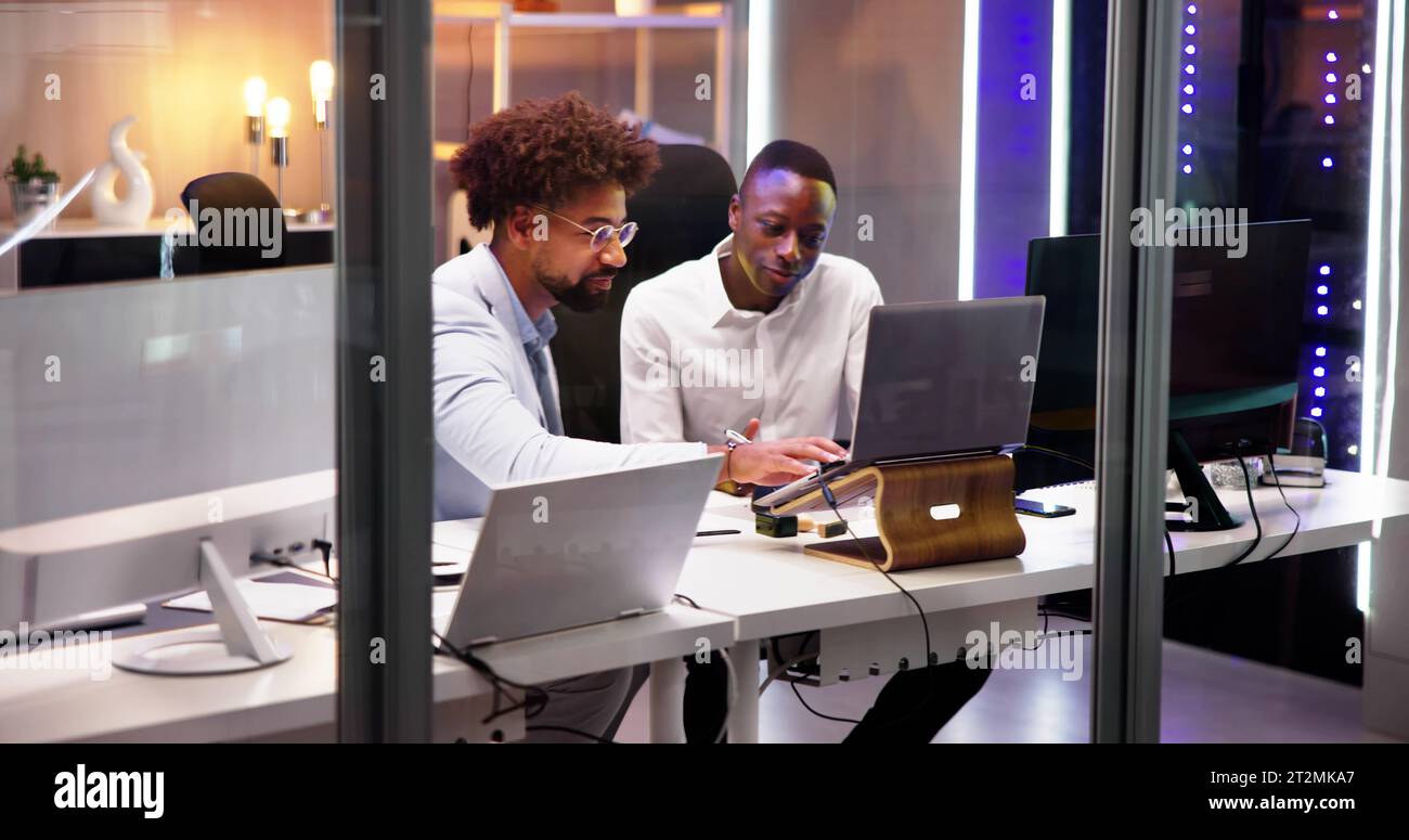 Business People Training On Computer. Young Workers In Office Stock Photo