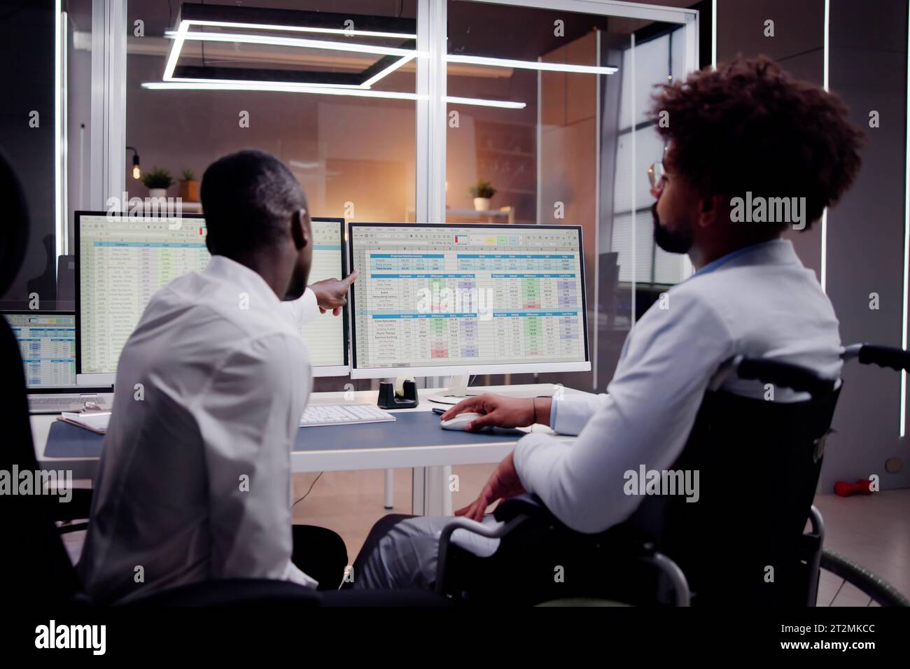 Analyst Working With Spreadsheet Business Data On Computer Stock Photo