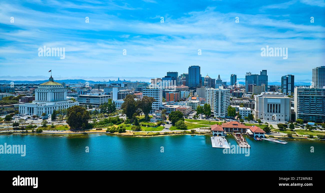 Low aerial of Oakland restaurant and downtown skyscrapers with