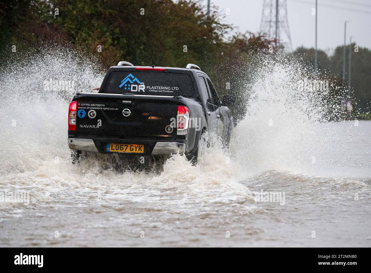 Vehicles brave the flooded Barnsdale Road in Leeds after the River Aire