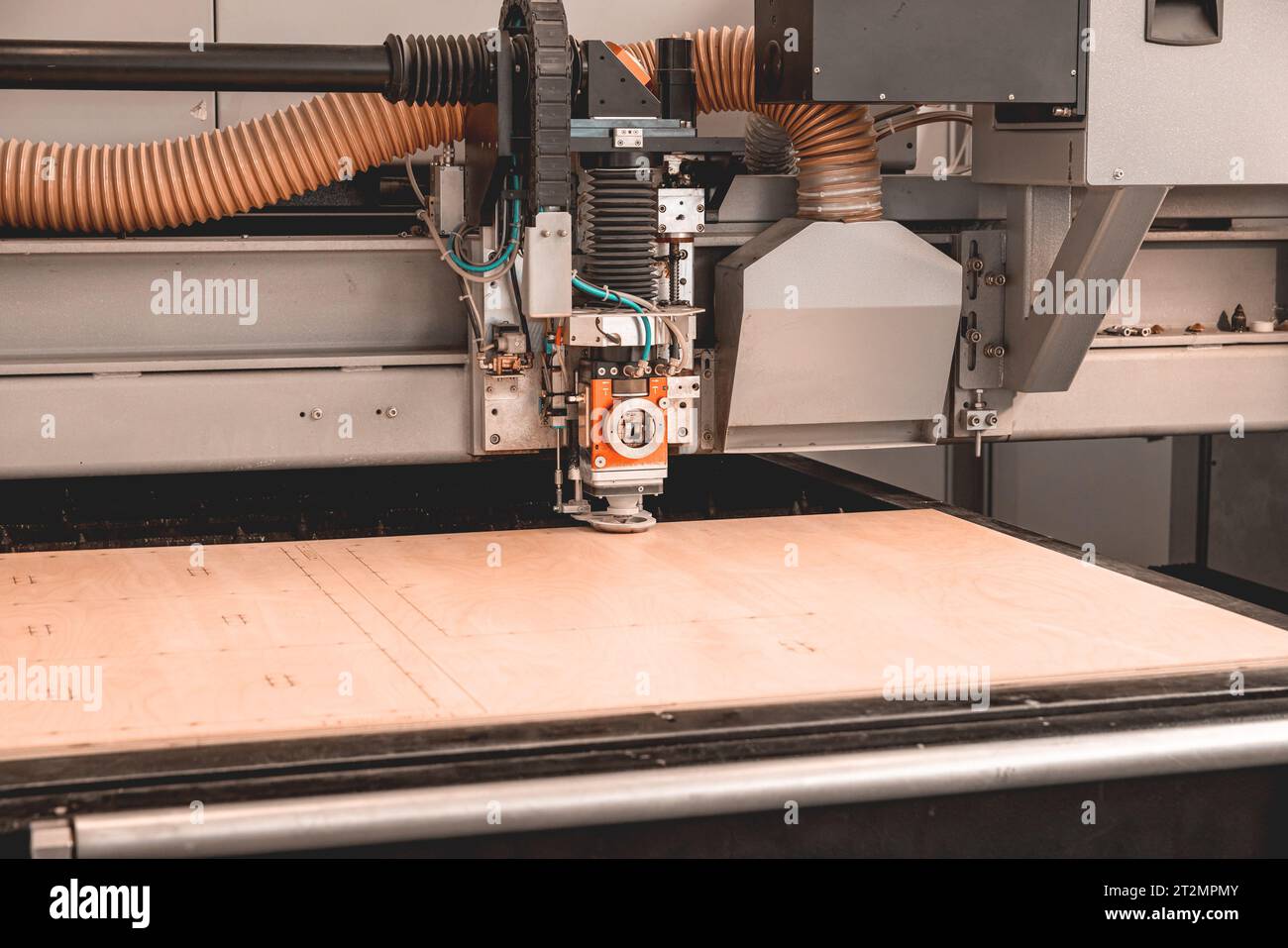 Laser cutting machine cutting the sheet of wood hi technology
