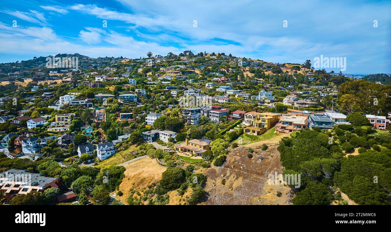 Tiburon houses on hillside and city skyline with blue sky and white clouds aerial Stock Photo