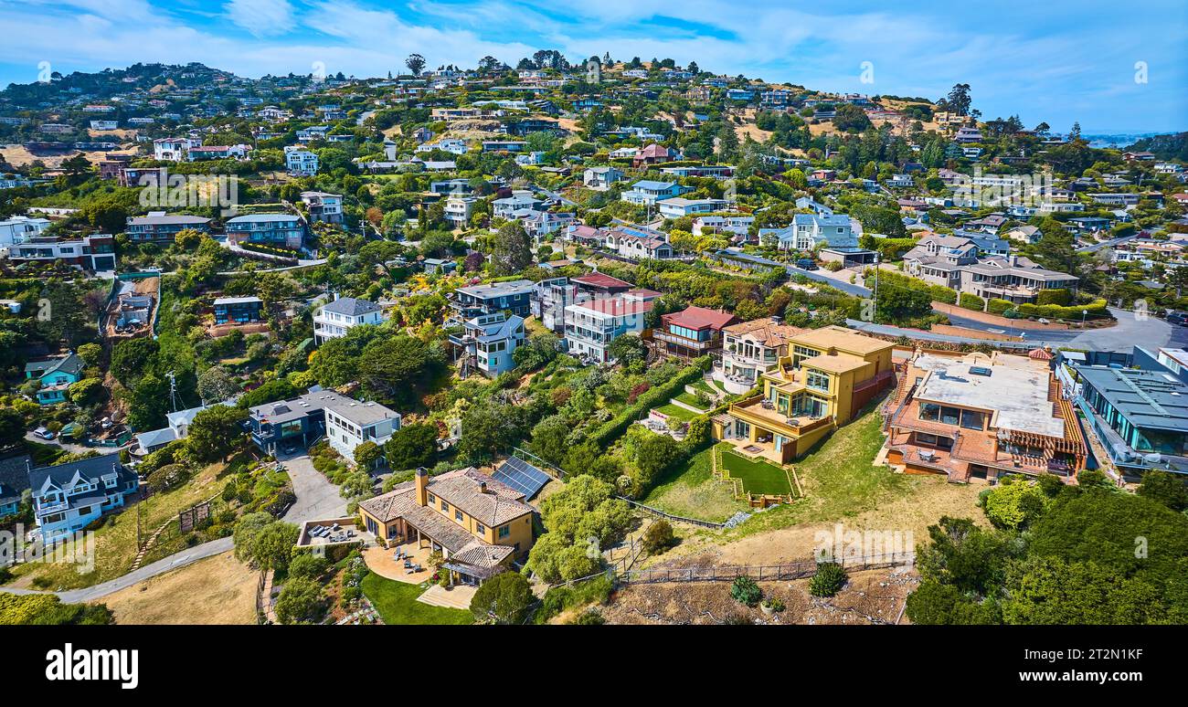 Aerial Tiburon houses on hillside and city skyline with blue sky and white clouds Stock Photo