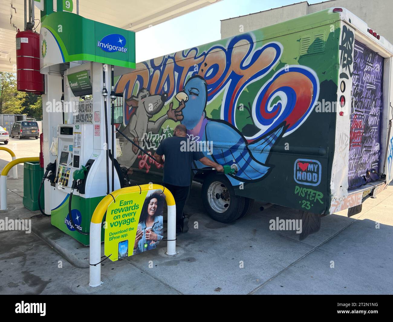 Man filling up his truck with gas at a gas station in Brooklyn, New ...