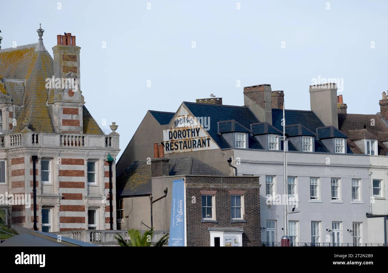 Old sign on gable end wall Dorothy Restaurant Regis, Weymouth