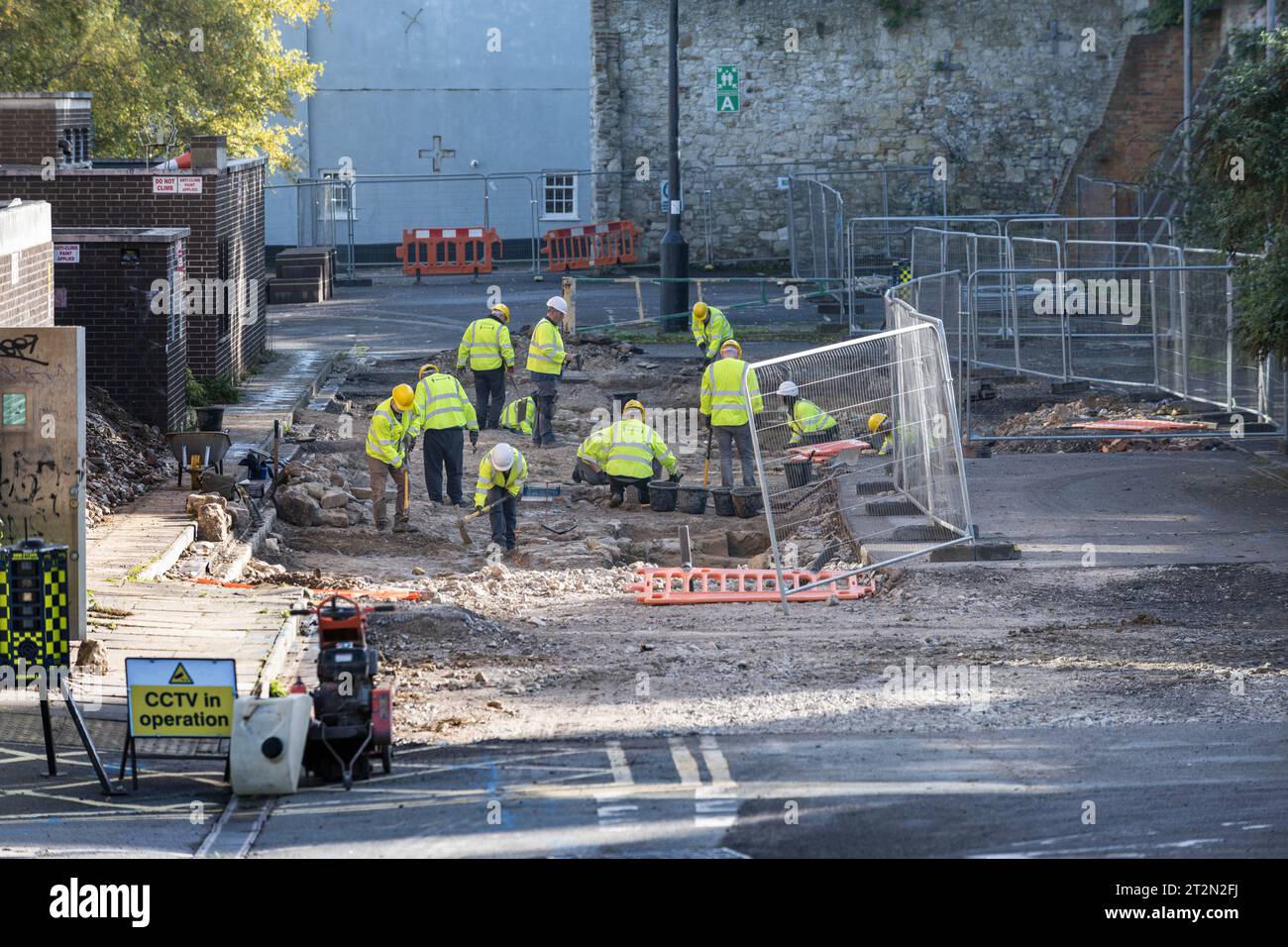 Archaeologists excavating historic site at North Quay in old Weymouth, Dorset, UK prior to the demolition of the council offices Stock Photo