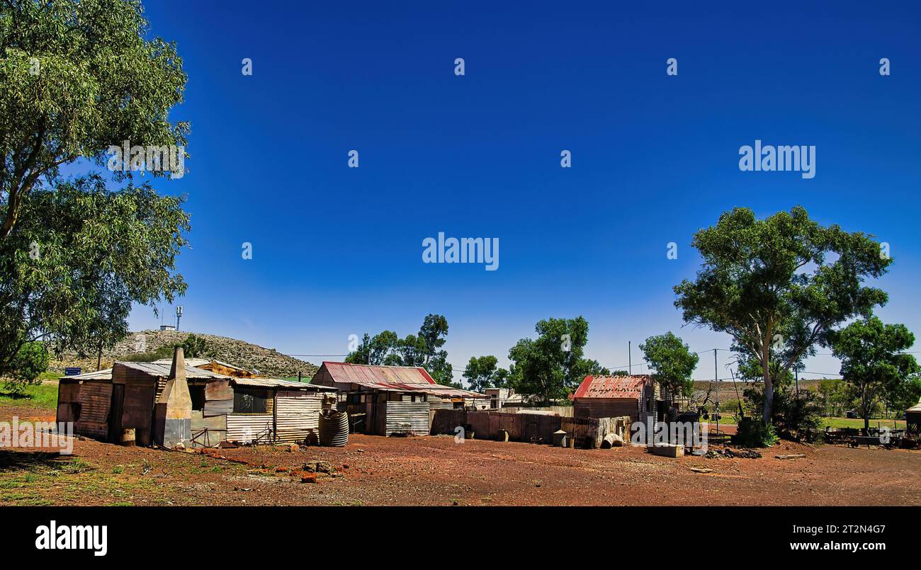 Panorama of a group of abandoned houses made of corrugated iron in the Western Australian outback. Ghost town of Gwalia, shire of Leonora. Stock Photo