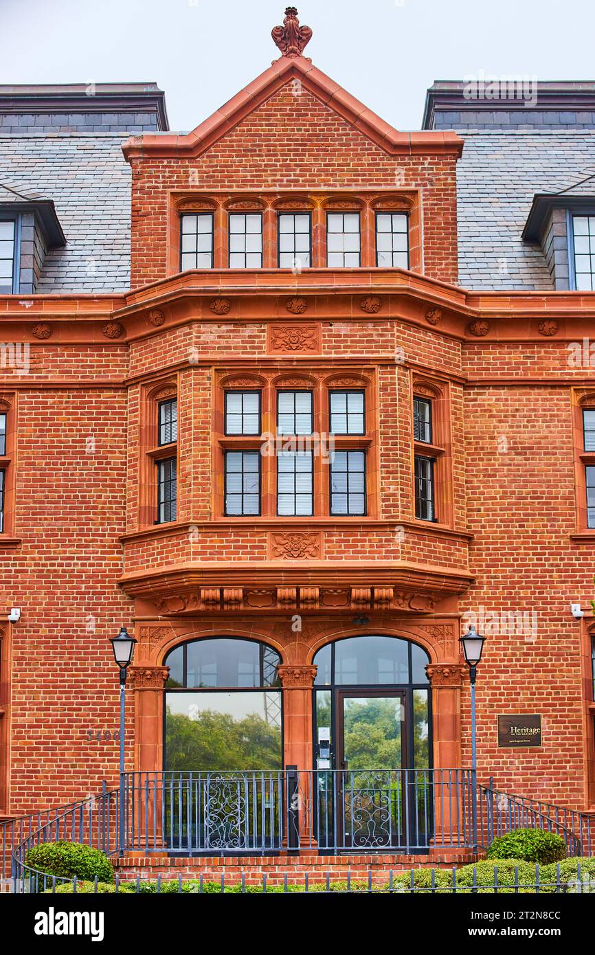 Large brick building with giant bay window and reflective front entry ...