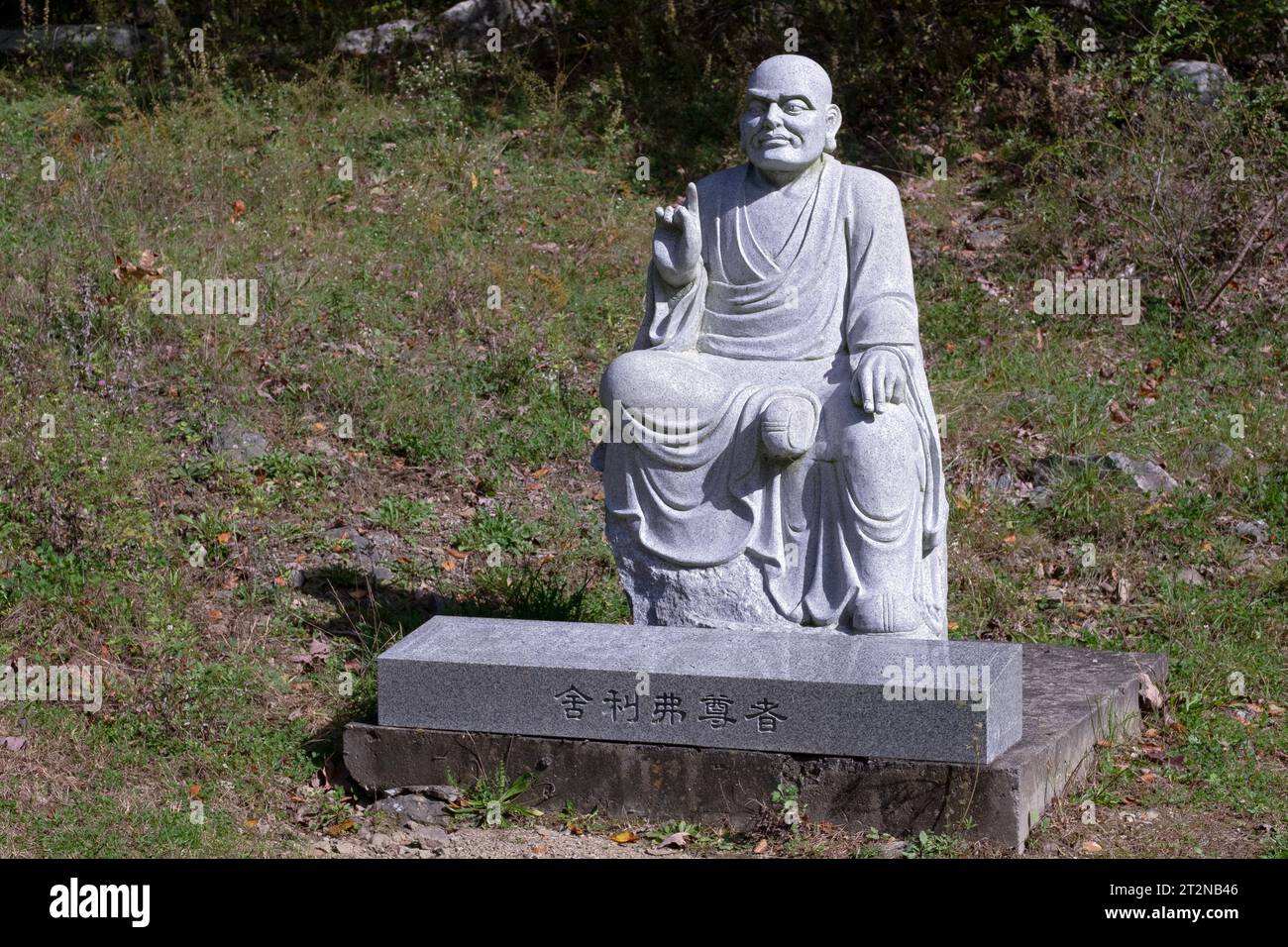 A statue of Sariputta Thera a significant 12th centruy Sri Lankan Monk. On the path to the Chuang Yen Buddhist Monastery in Carmel, Putnam County, NY. Stock Photo