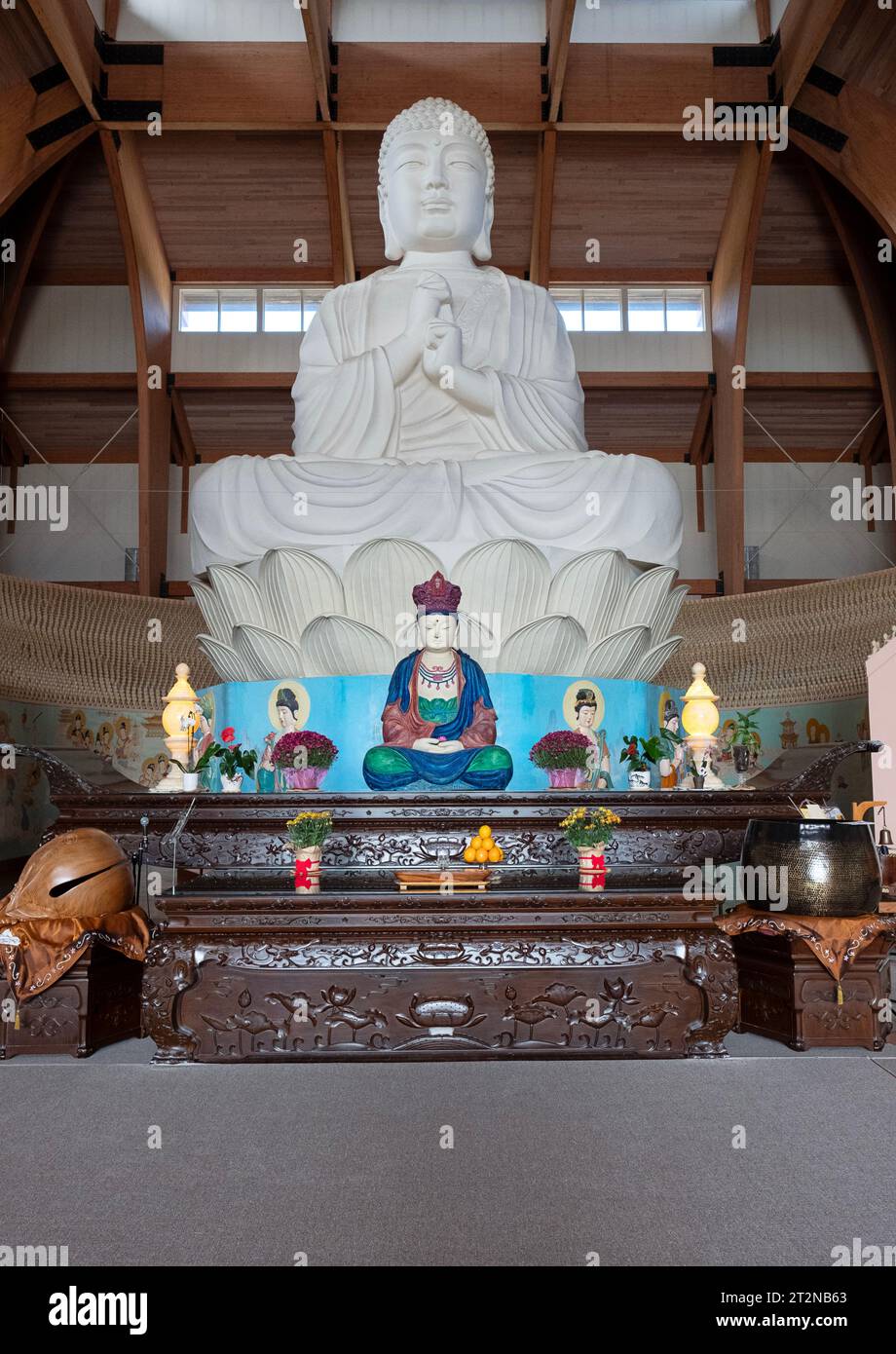 The interior of the Chuang Yen Buddhist Monastery in Carmel, Putnam Cty, New York showing the largest Buddha statue in the western hemisphere. Stock Photo