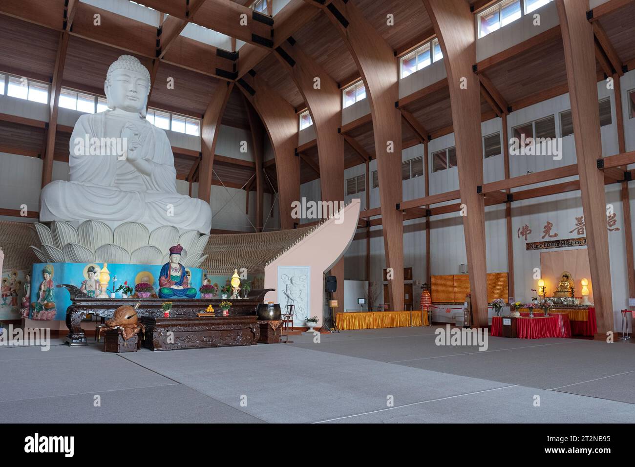 The interior of the Chuang Yen Buddhist Monastery in Carmel, Putnam County, New York showing the largest Buddha statue in the western hemisphere. Stock Photo