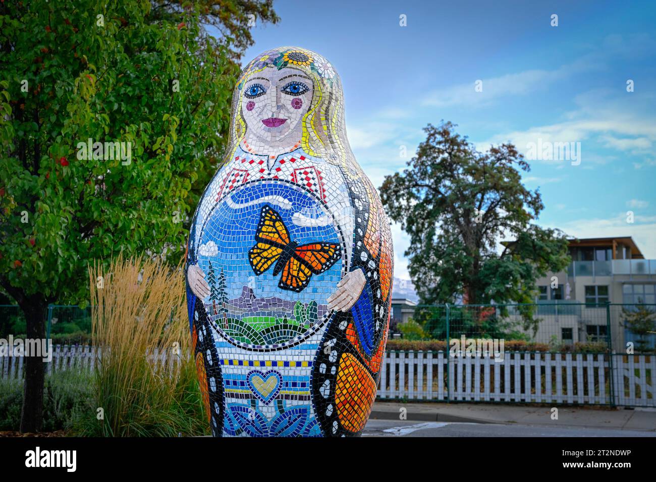 Matryoshka doll with monarch butterfly coat, Art mosaic by Peter Vogelaar, Okanagan Lake Beach, Penticton, Okanagan, British Columbia, Canada Stock Photo