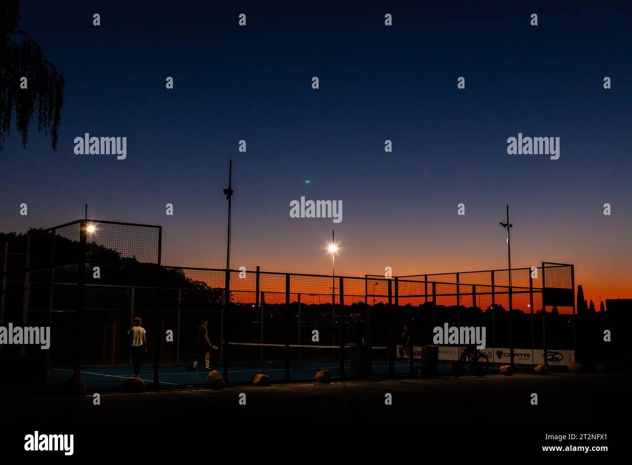Sunset over padel tennis court Stock Photo