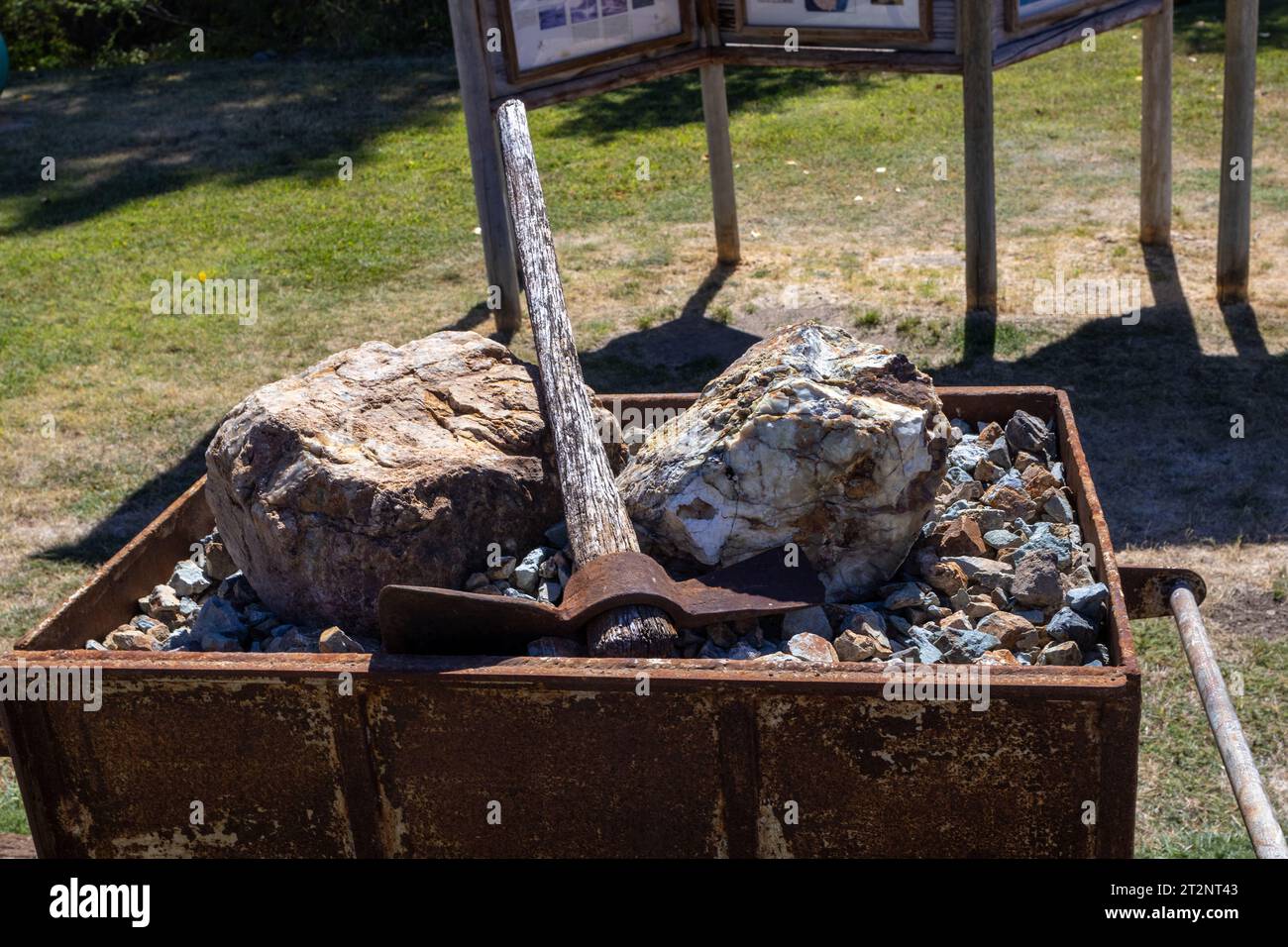ore, pick ax in an old coal car Stock Photo