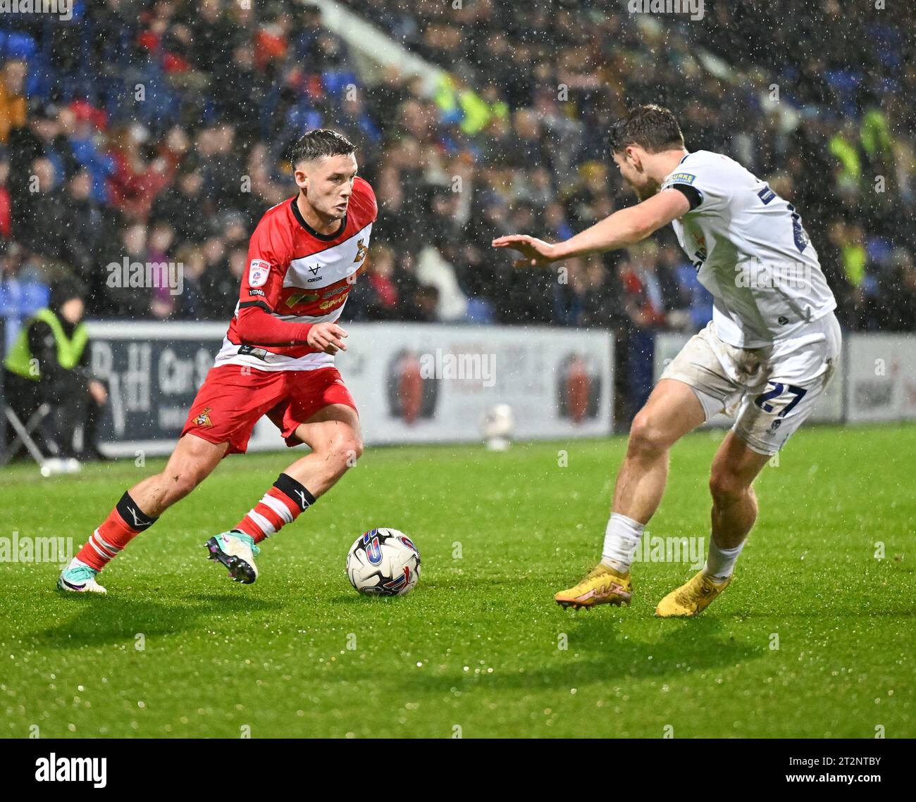 Luke Molyneux 7 of Doncaster Rovers Football Club drives the ball