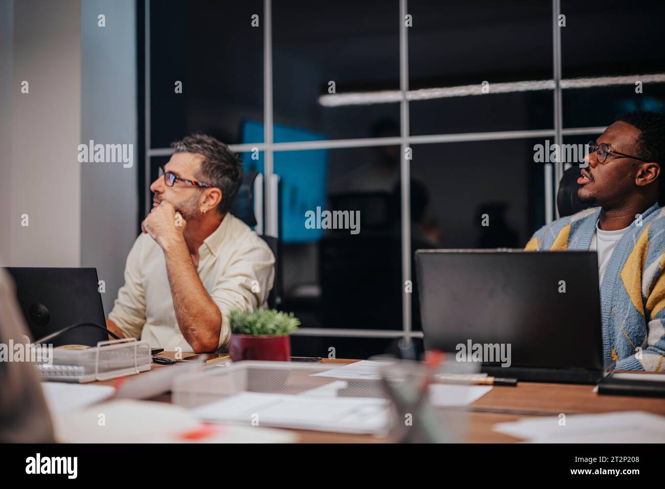 Multicultural professionals collaborate in a boardroom, discussing ...