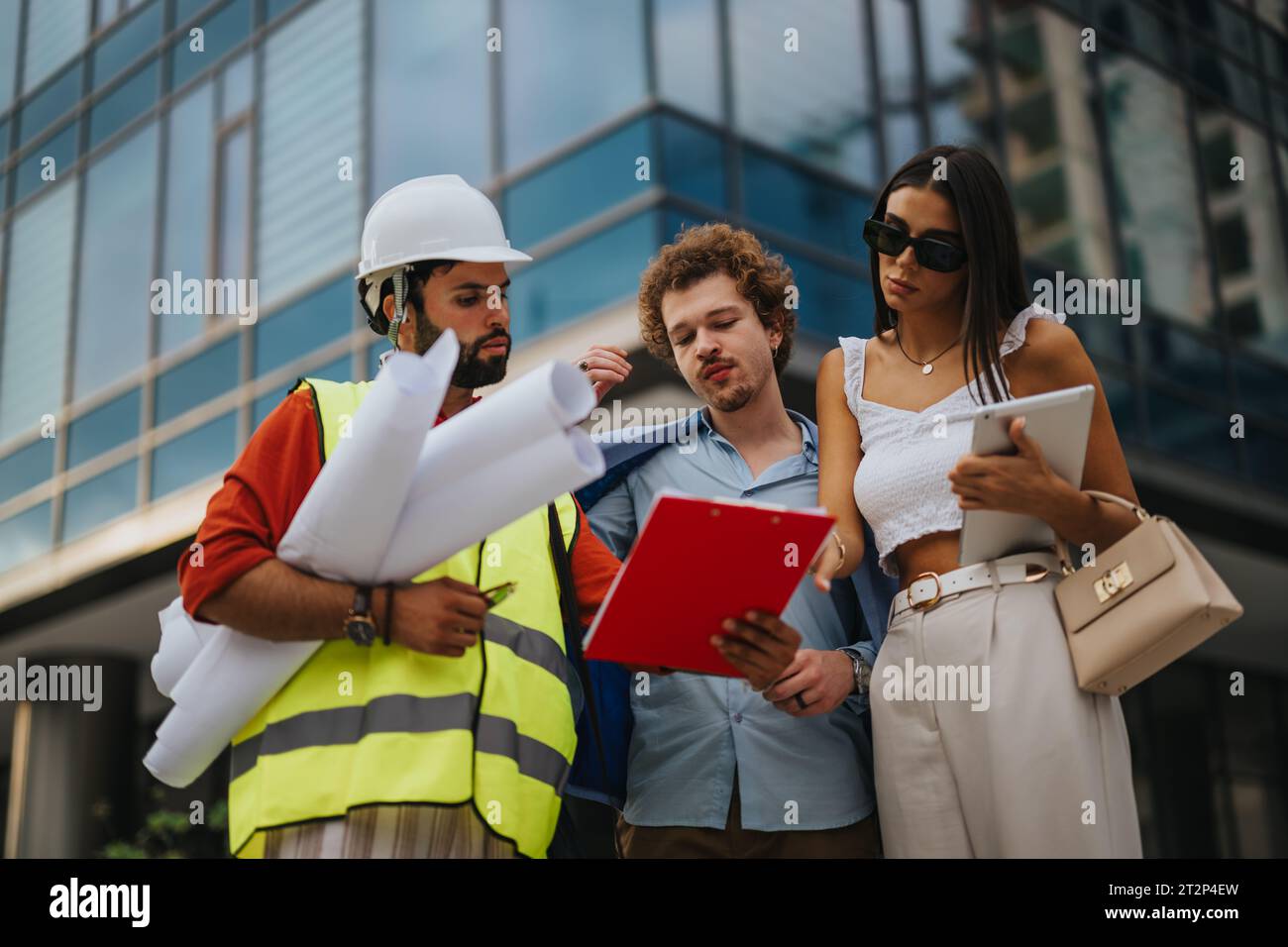 Architects and Engineers Collaborating on Urban Development Project Stock Photo