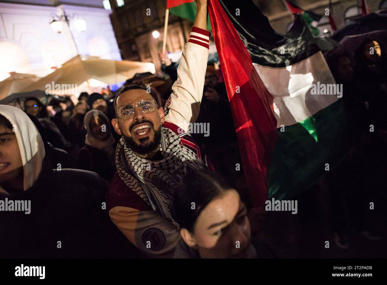 Warsaw, Poland. 20th Oct, 2023. Protesters chant slogans during the pro-Palestinian rally in Warsaw. Hundreds of people - among them Palestinians - gathered in pouring rain in Warsaw's center to protest under the slogan 'Stop ethnic cleansing in Gaza'. The pro-Palestinian demonstrators demand end of bombing civilian targets in Gaza by Israel, open the humanitarian corridors and provide food, water and medicine to the inhabitants of the Gaza Strip. Protesters chanted slogans like 'Free Palestine' or 'Israel is a terrorist state'. Credit: SOPA Images Limited/Alamy Live News Stock Photo