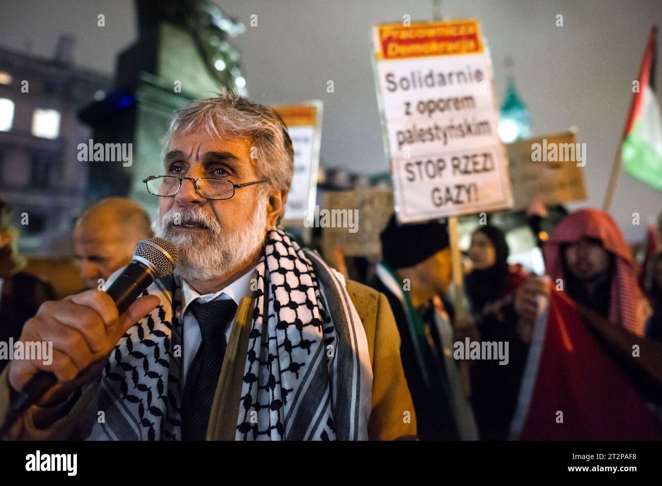 The Palestinian ambassador to Poland, Mahmoud Khalifa speaks during the pro-Palestinian rally in Warsaw. Hundreds of people - among them Palestinians - gathered in pouring rain in Warsaw's center to protest under the slogan 'Stop ethnic cleansing in Gaza'. The pro-Palestinian demonstrators demand end of bombing civilian targets in Gaza by Israel, open the humanitarian corridors and provide food, water and medicine to the inhabitants of the Gaza Strip. Protesters chanted slogans like 'Free Palestine' or 'Israel is a terrorist state'. Stock Photo