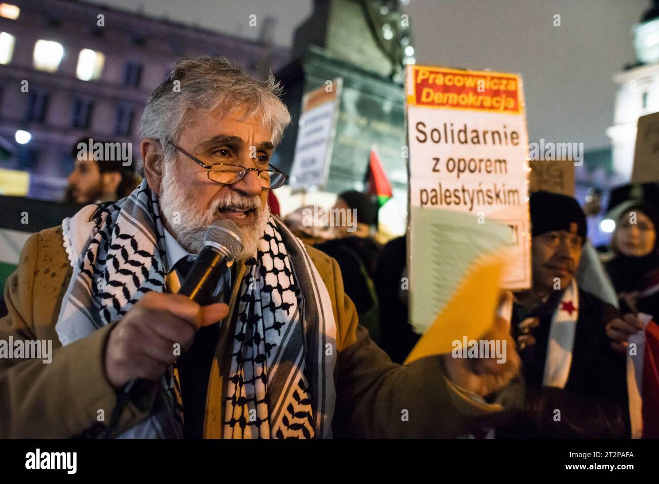 The Palestinian ambassador to Poland, Mahmoud Khalifa speaks during the pro-Palestinian rally in Warsaw. Hundreds of people - among them Palestinians - gathered in pouring rain in Warsaw's center to protest under the slogan 'Stop ethnic cleansing in Gaza'. The pro-Palestinian demonstrators demand end of bombing civilian targets in Gaza by Israel, open the humanitarian corridors and provide food, water and medicine to the inhabitants of the Gaza Strip. Protesters chanted slogans like 'Free Palestine' or 'Israel is a terrorist state'. Stock Photo