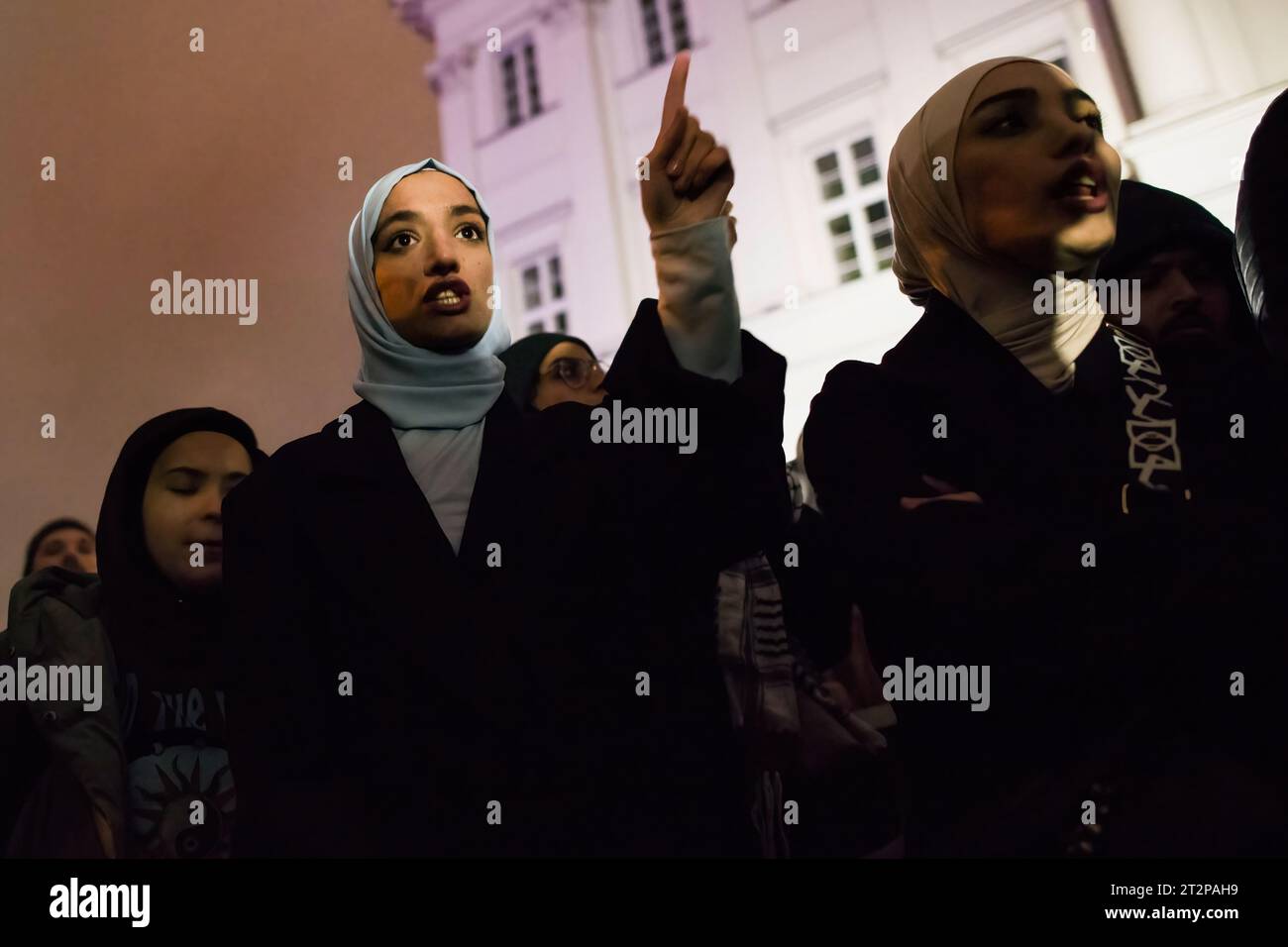 Protesters chant slogans during the pro-Palestinian rally in Warsaw. Hundreds of people - among them Palestinians - gathered in pouring rain in Warsaw's center to protest under the slogan 'Stop ethnic cleansing in Gaza'. The pro-Palestinian demonstrators demand end of bombing civilian targets in Gaza by Israel, open the humanitarian corridors and provide food, water and medicine to the inhabitants of the Gaza Strip. Protesters chanted slogans like 'Free Palestine' or 'Israel is a terrorist state'. (Photo by Attila Husejnow/SOPA Images/Sipa USA) Stock Photo