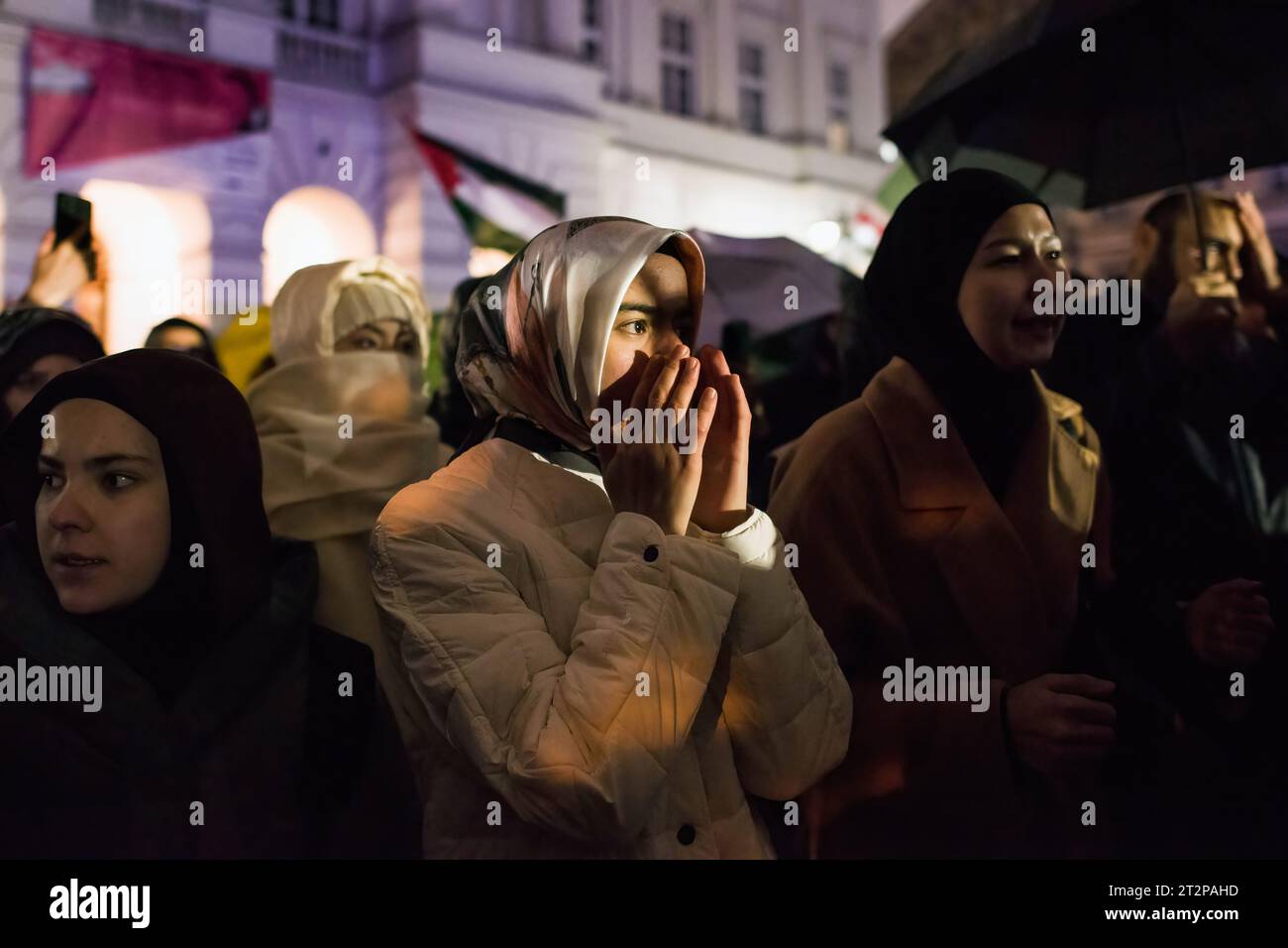 Protesters chant slogans and gesture during the pro-Palestinian rally in Warsaw. Hundreds of people - among them Palestinians - gathered in pouring rain in Warsaw's center to protest under the slogan 'Stop ethnic cleansing in Gaza'. The pro-Palestinian demonstrators demand end of bombing civilian targets in Gaza by Israel, open the humanitarian corridors and provide food, water and medicine to the inhabitants of the Gaza Strip. Protesters chanted slogans like 'Free Palestine' or 'Israel is a terrorist state'. (Photo by Attila Husejnow/SOPA Images/Sipa USA) Stock Photo