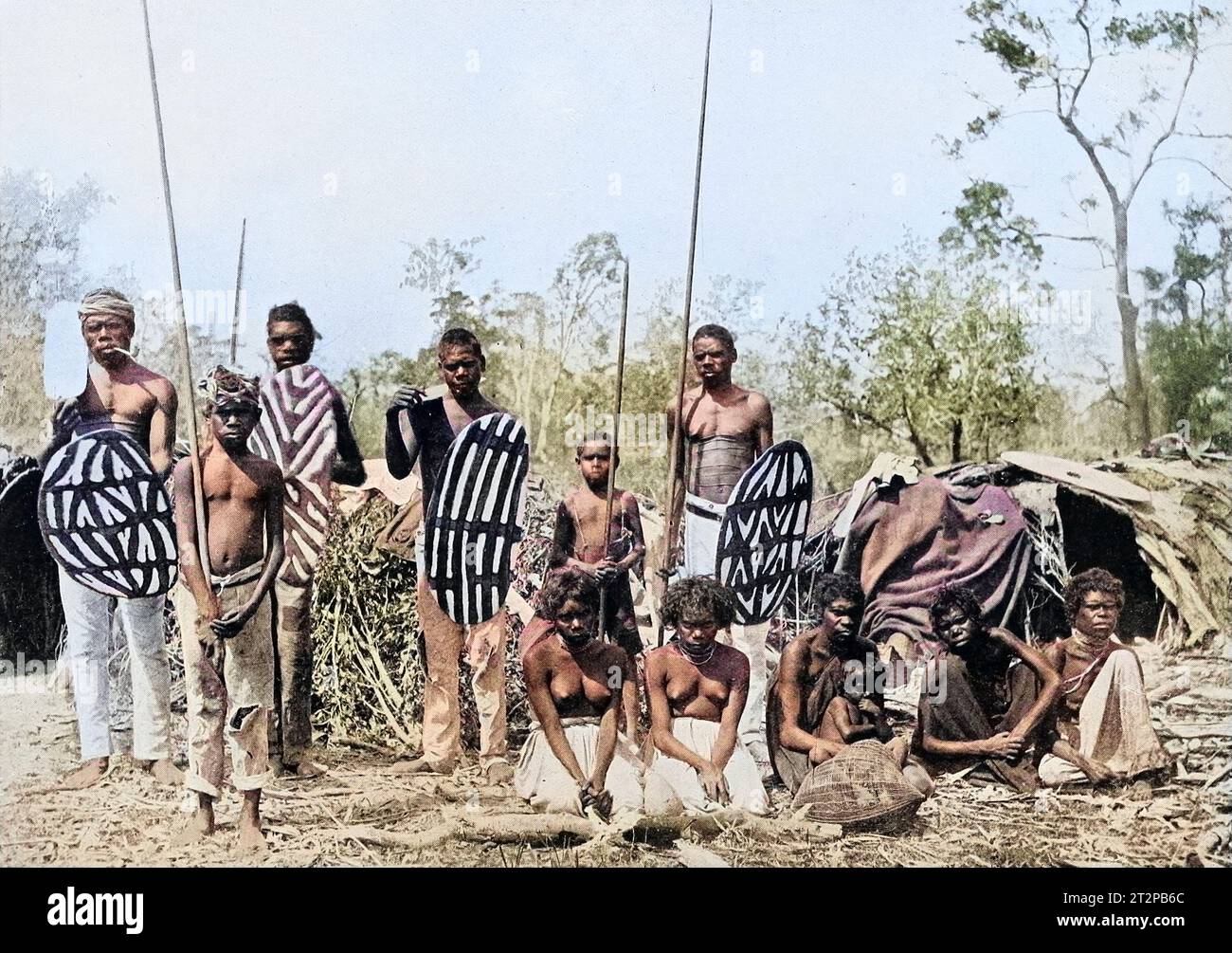 Queensland natives carrying spears and shields Stock Photo