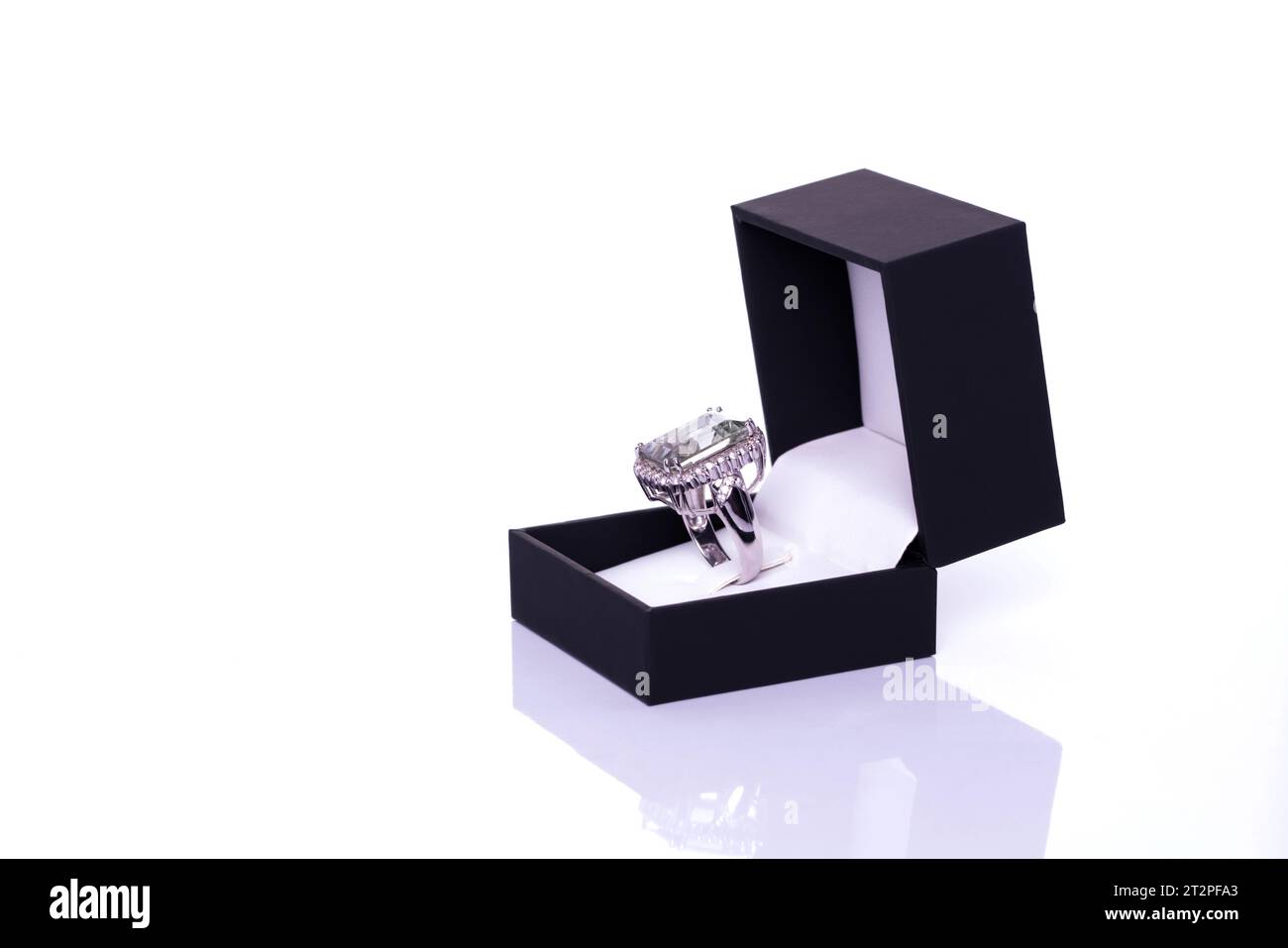 Elegant ring showcased in a sleek black box, set against a clean white backdrop. Ideal for jewelry ads, gift-giving campaigns, or product showcases. E Stock Photo