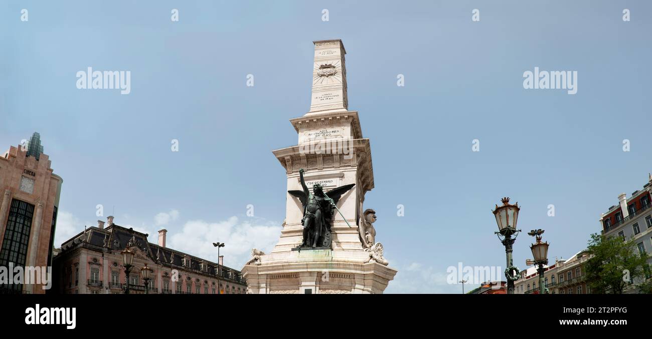 Monument to the Restorers, Restauradores Square, Lisbon, Portugal.  The 14.6 meter (48ft) tall monument created in 1886 stands in the center of Restauradores Square in the center of Lisbon, the monument celebrates the restoration of Portuguese Independence from Spain in 1640. Stock Photo