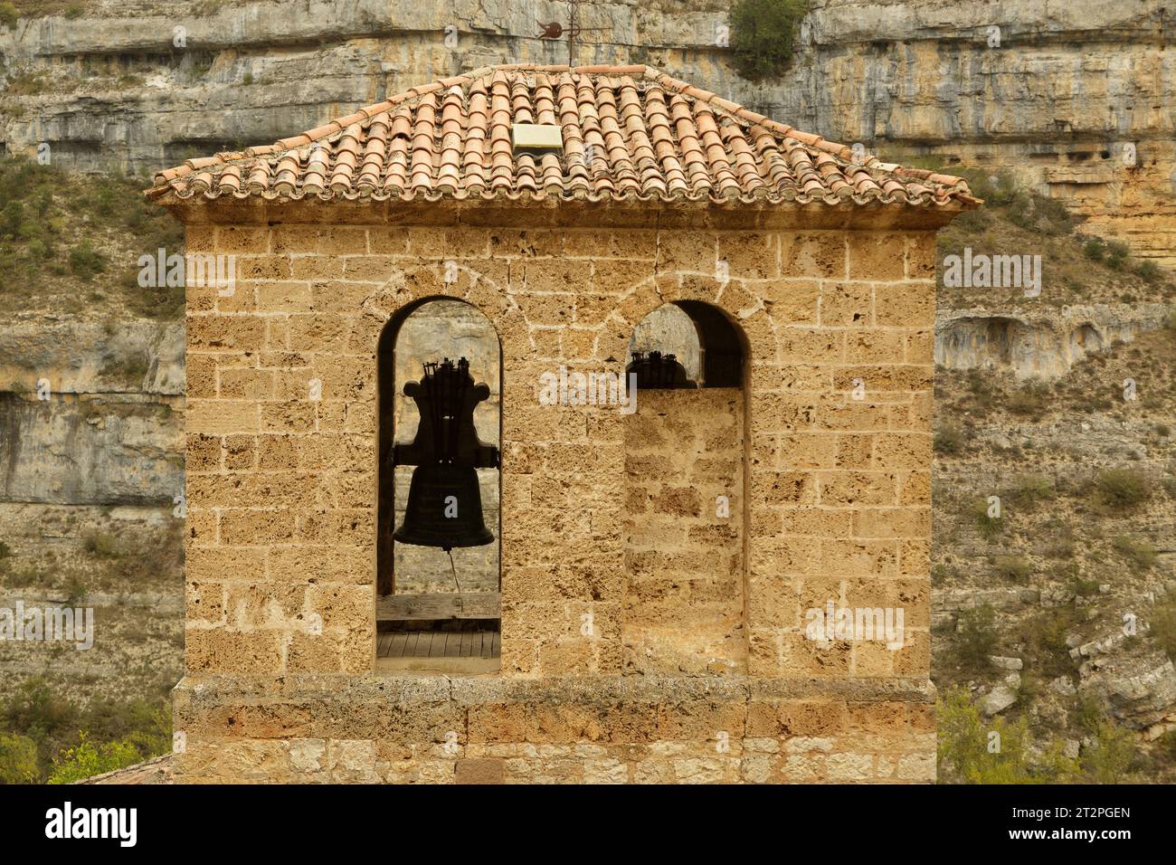 Bell tower of the Romanesque church in Orbaneja del Castillo. Town of Burgos in Castilla y Leon, Spain. rural tourism Stock Photo