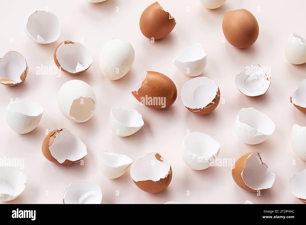 Springtime easter layout. Empty broken chicken eggshells. Stock Photo