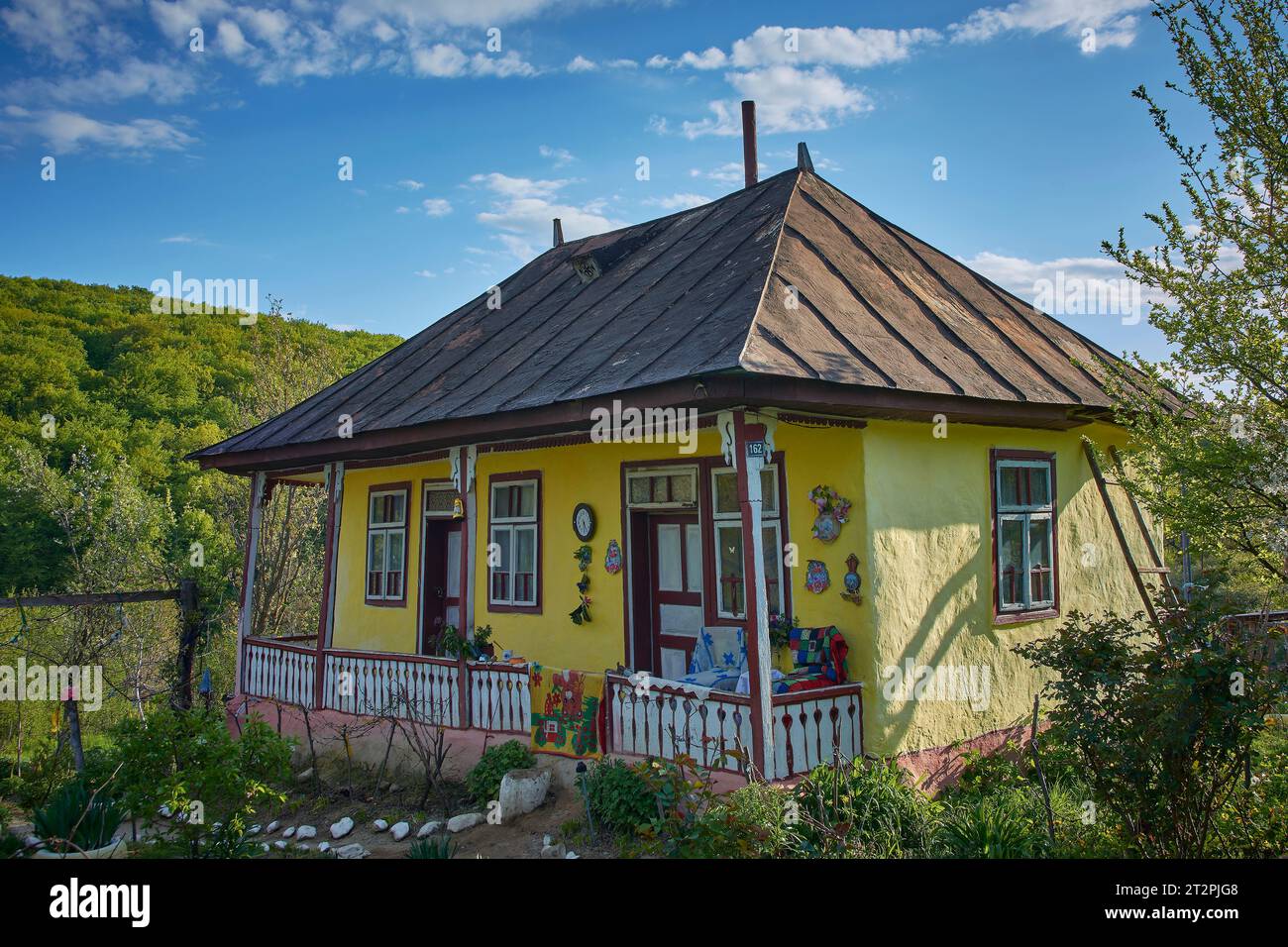 the beautiful house in the country with flowering trees in spring in Romania Stock Photo