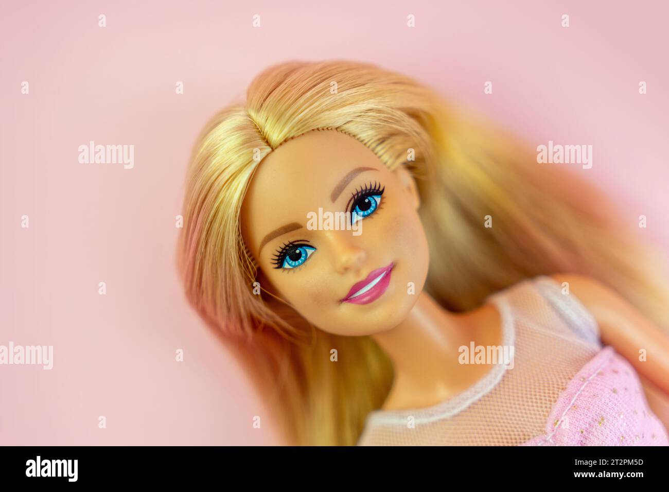 October 9, 2023. Barnaul, Russia: Portrait of a Barbie doll with loose blond hair on a pink background. Portrait of a Barbie. Stock Photo